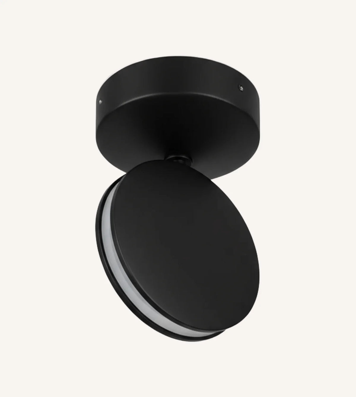 Black rotating-disc LED ceiling spotlight against a plain background