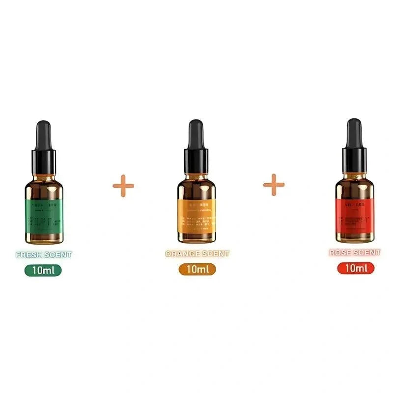 Three fragrance oil bottles