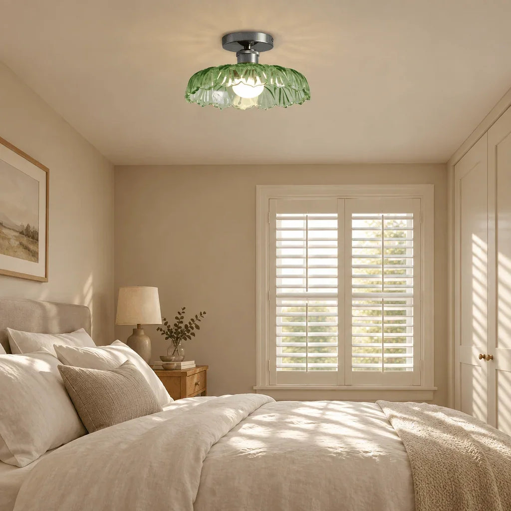 Green glass ceiling light in a bedroom