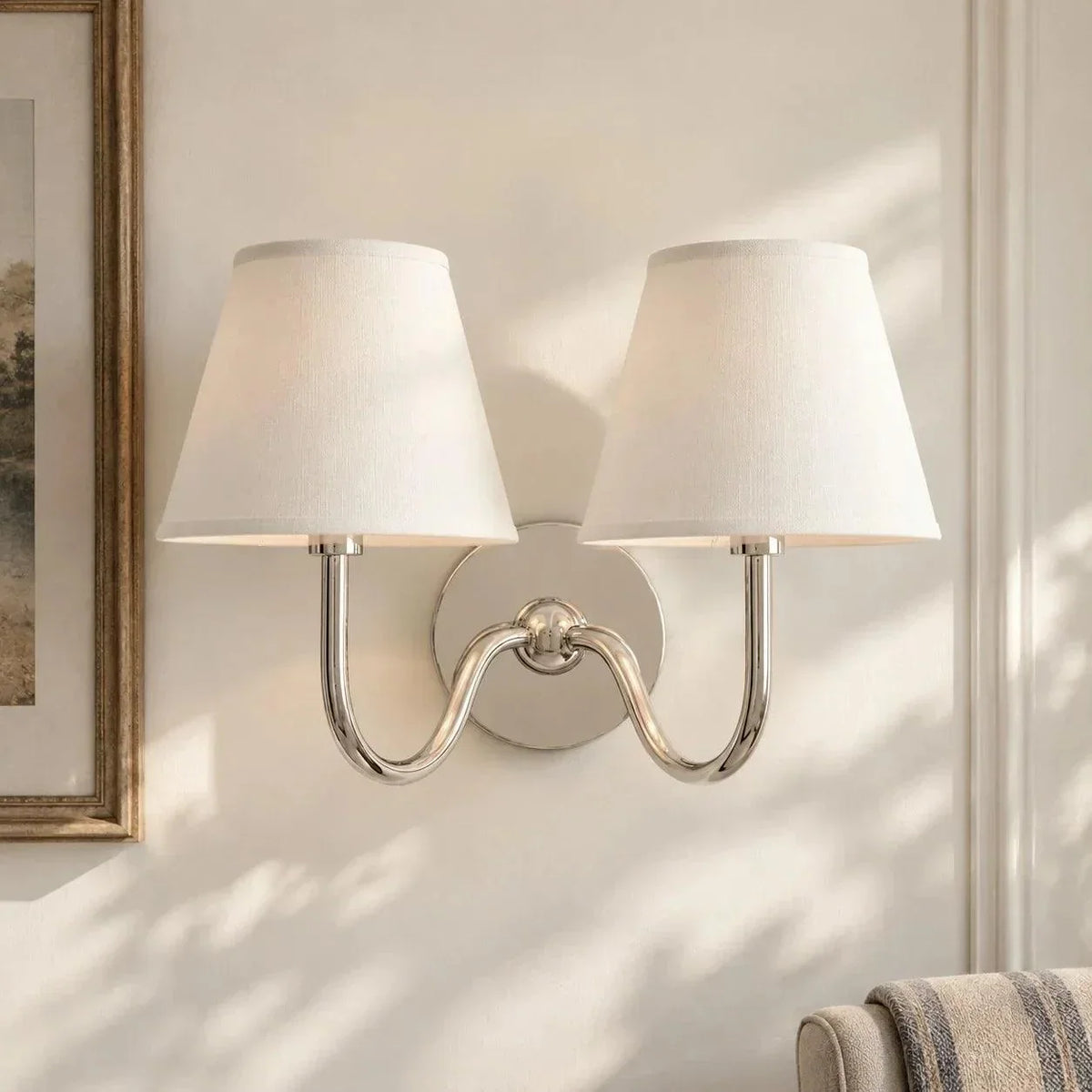 Chrome double-arm wall light with plain shades