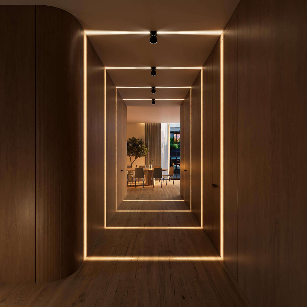 Black rotating-disc ceiling spotlight in a warm-lit hallway