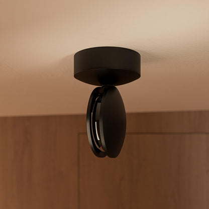 Black rotating-disc LED ceiling spotlight viewed from the side