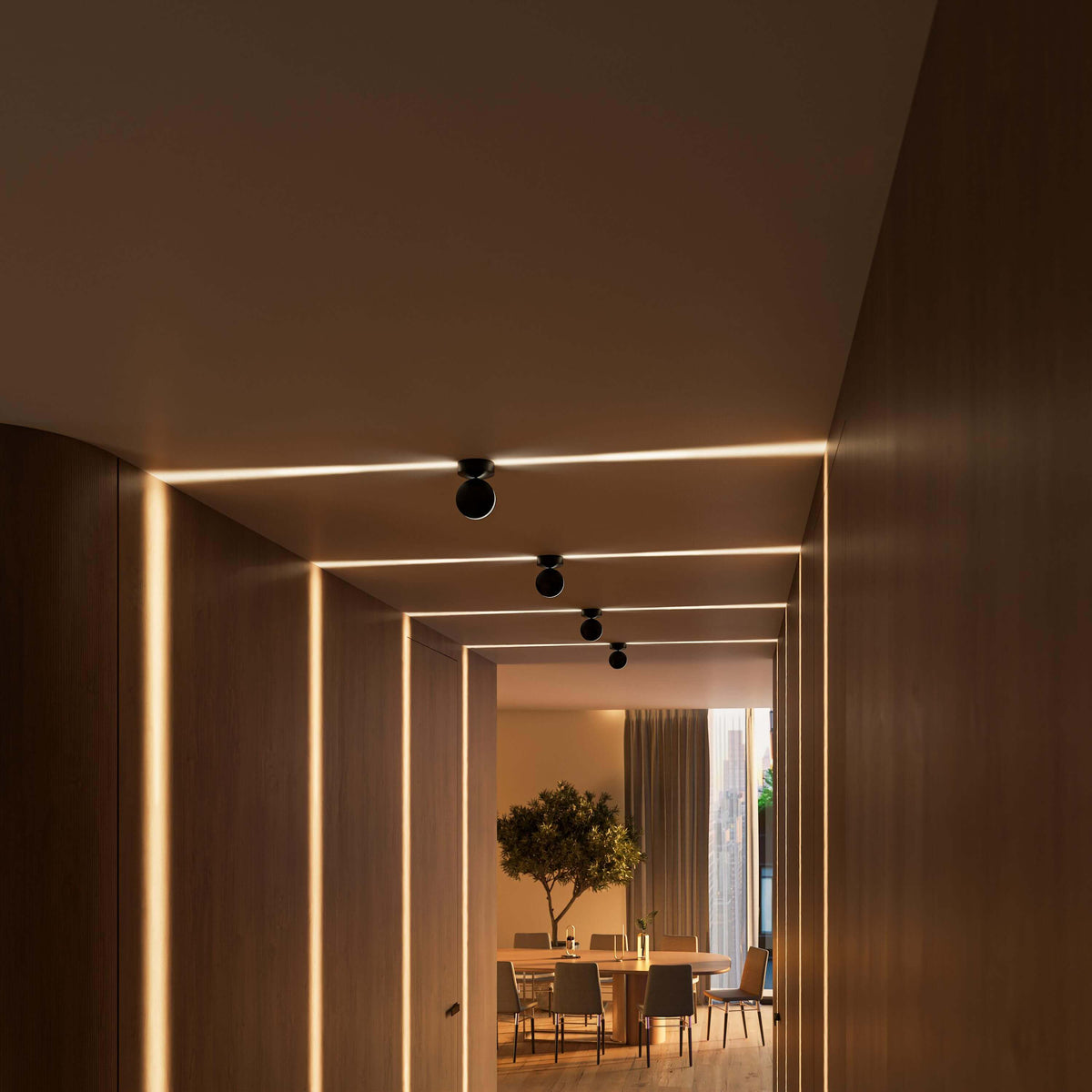 Black adjustable ceiling spotlights creating geometric light patterns