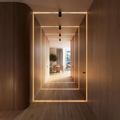 Black LED ceiling spotlights in a bright hallway