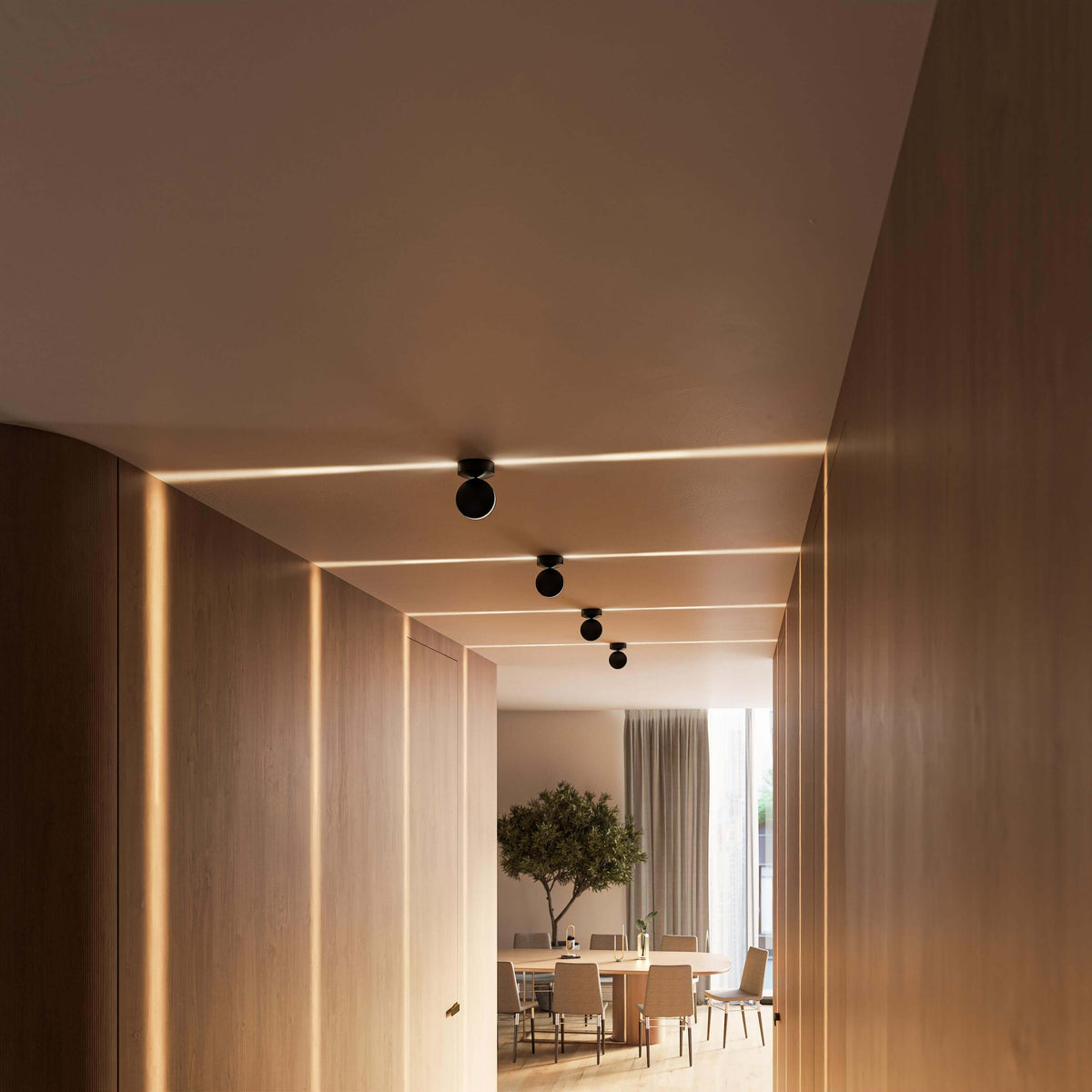 Black LED ceiling spotlight directing light across a ceiling