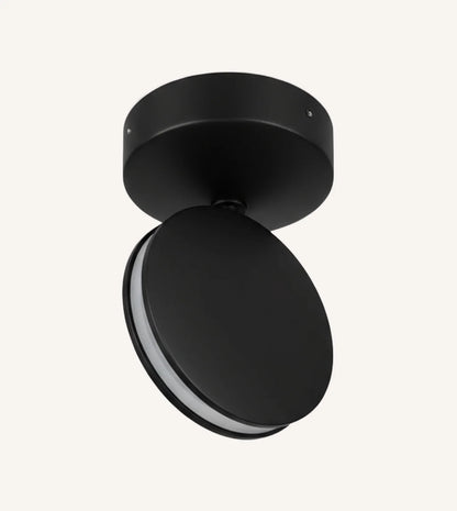 Black rotating-disc LED ceiling spotlight against a plain background