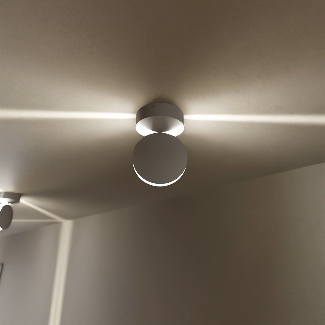 White rotating-disc LED ceiling spotlights in a hallway