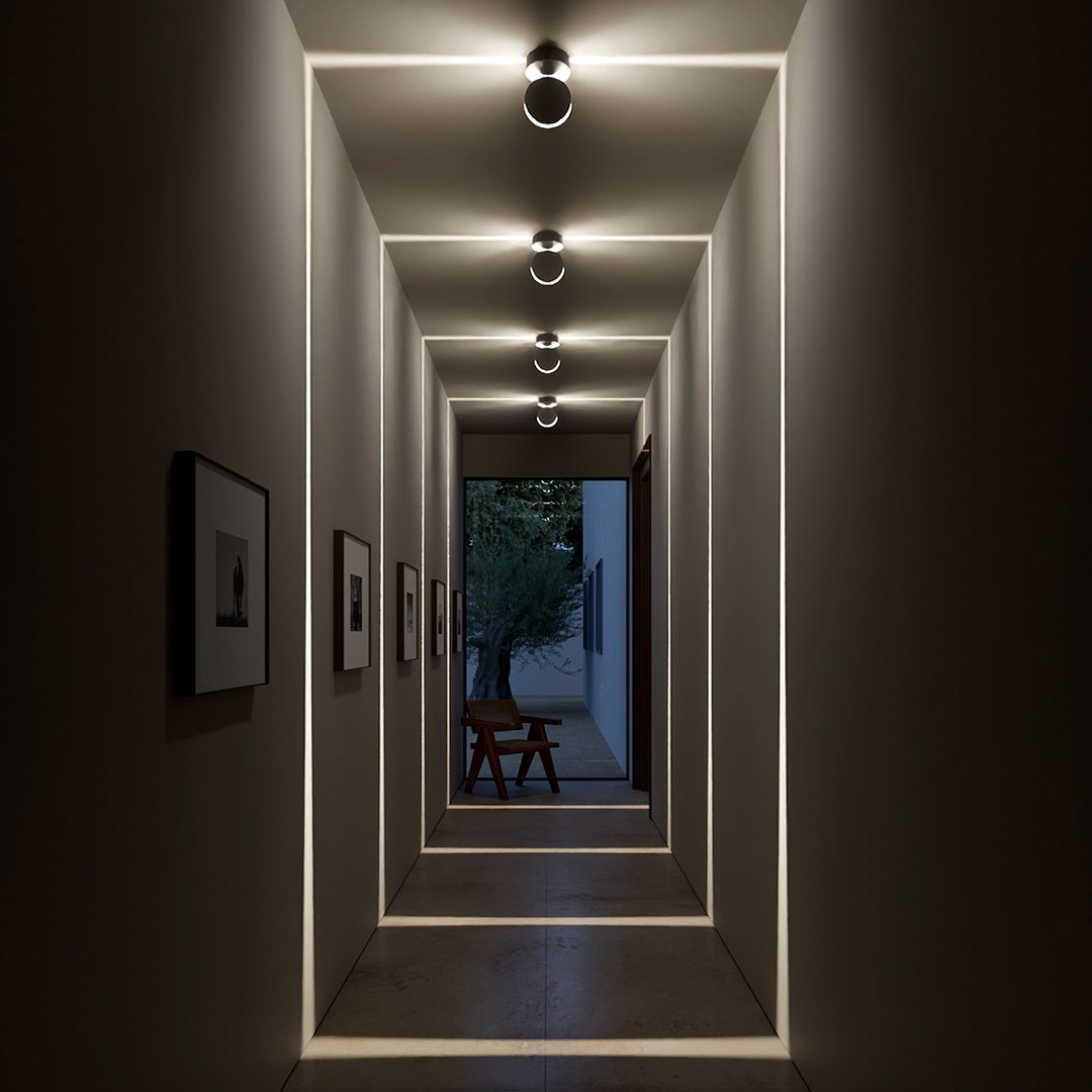 Black adjustable LED ceiling spotlights in a hallway