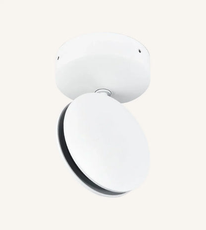 White rotating-disc LED ceiling spotlight against a plain background