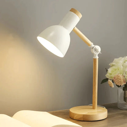 White pivoting task lamp illuminating a book