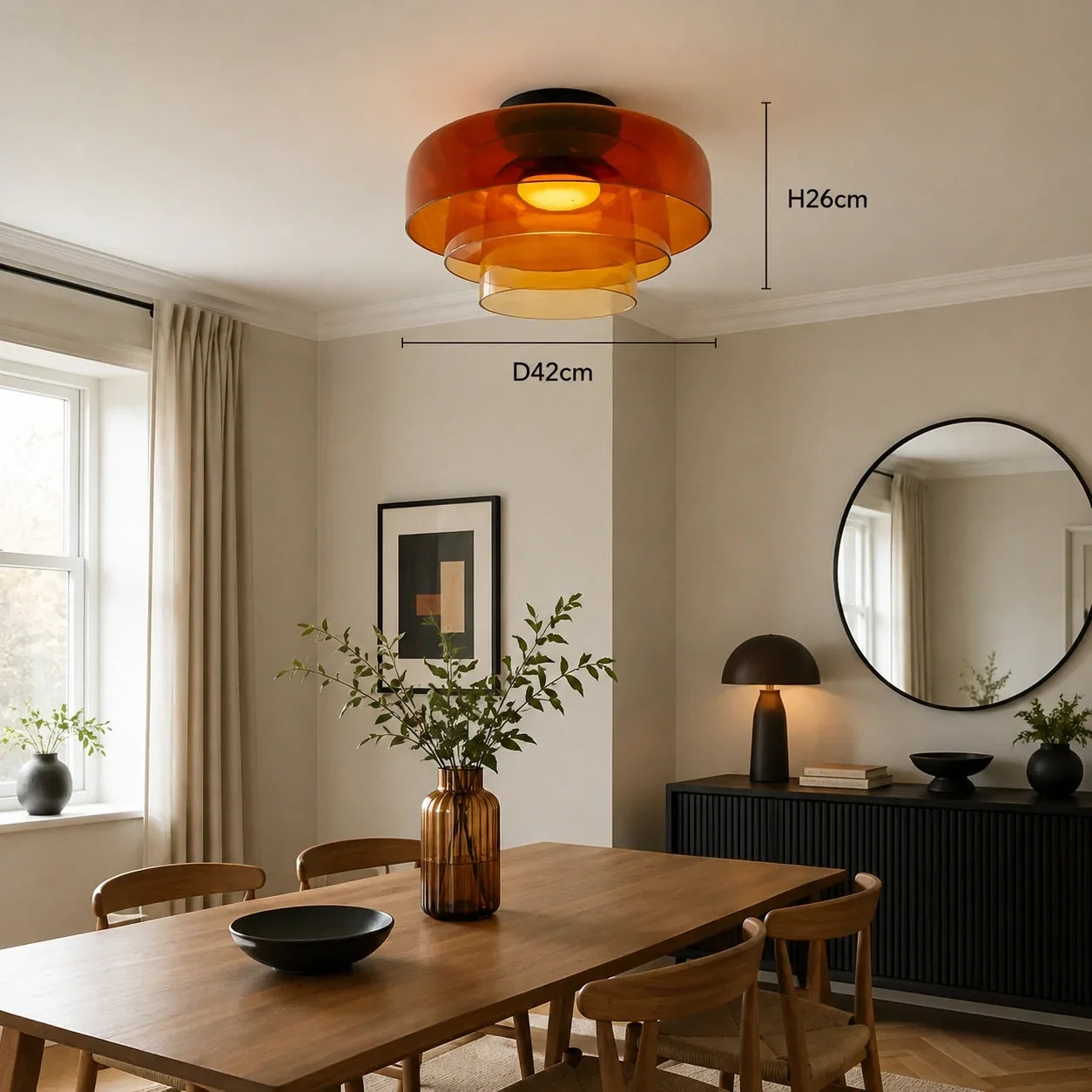 Amber tiered glass Art Deco ceiling light with a warm glow, measuring 42cm wide and 26cm high, styled in a contemporary dining room.