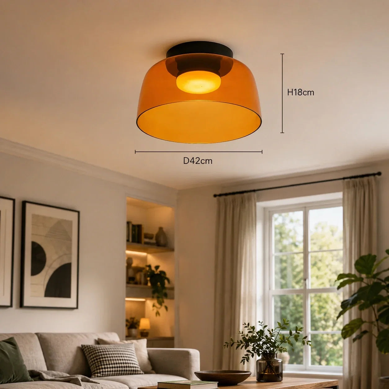 Art Deco amber glass ceiling light with a black base, glowing with warm light in a living room. Dimensions shown as 42cm diameter and 18cm height.