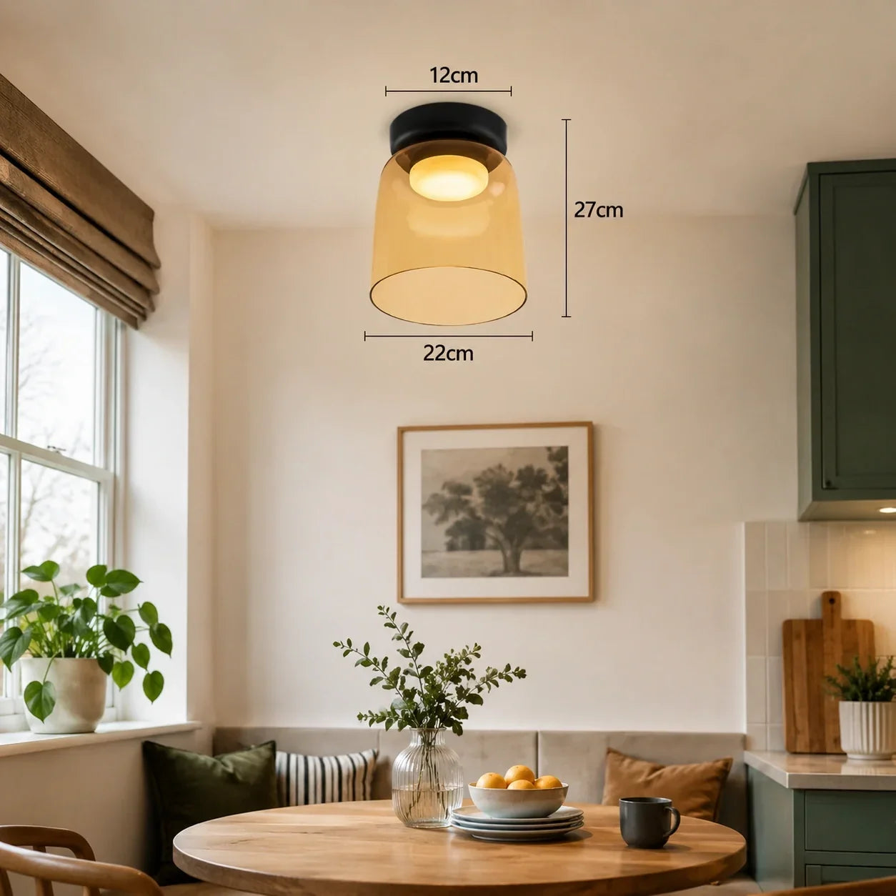 An Art Deco glass ceiling light with an amber shade and black mount, showing dimensions of 27cm height and 22cm width in a warm dining room.