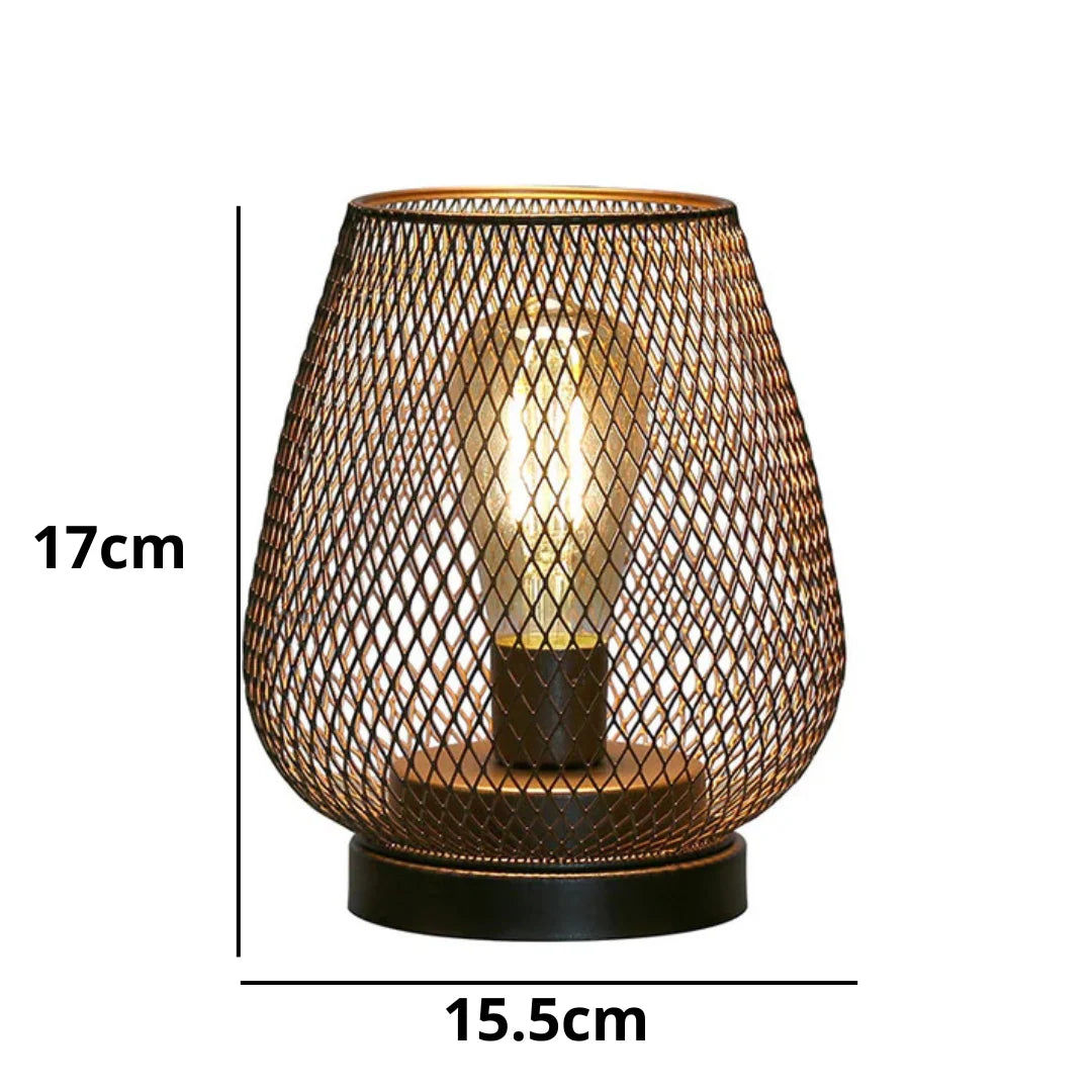 Battery operated LED table lamp with a decorative bronze mesh cage design, measuring 17cm in height and 15.5cm in width for ambient industrial decor.