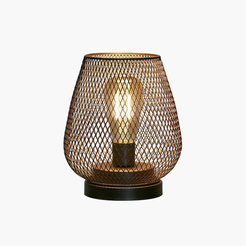 Battery-operated LED table lamp featuring a bronze-coloured wire mesh shade and a glowing filament bulb, set on a circular black base.