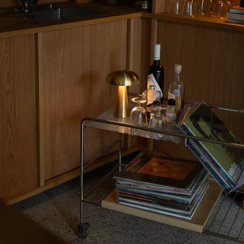 Gold battery lamp on a drinks trolley