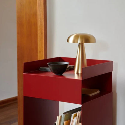 Gold cordless table lamp on a side table
