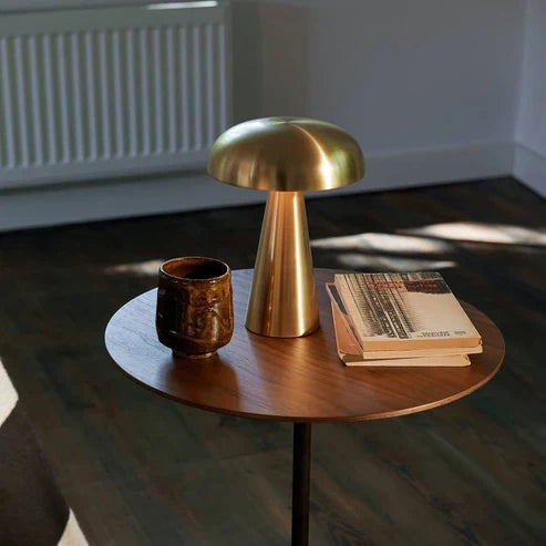 Gold battery table lamp in a living room
