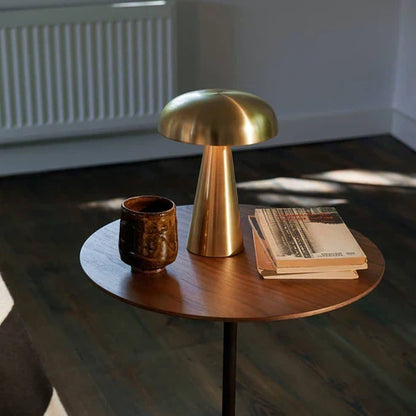 Gold battery table lamp in a living room
