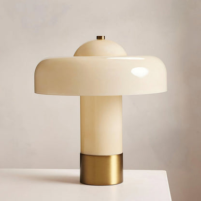 Close-up of beige glass shade and metallic base