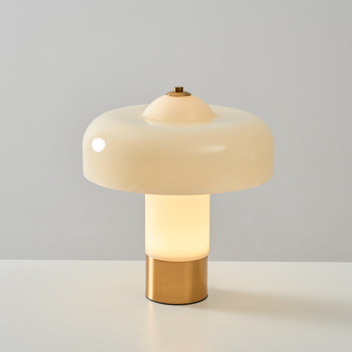 Illuminated beige domed glass lamp
