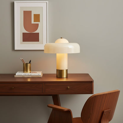 Glass column table lamp on a timber desk