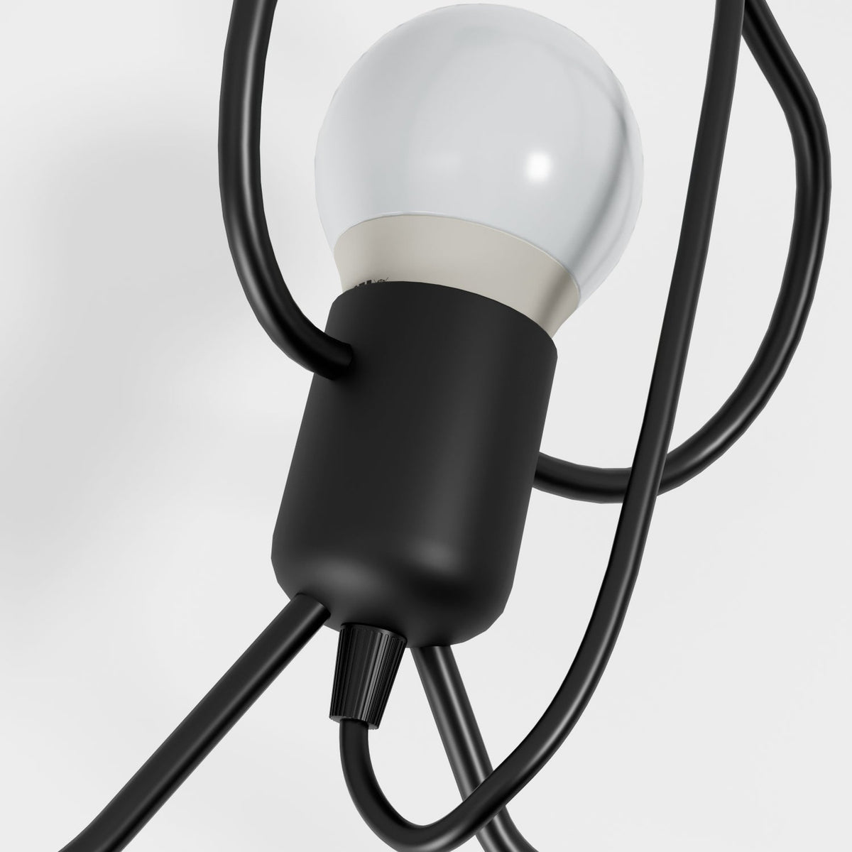 Close view of bulb holder and wrought iron figure