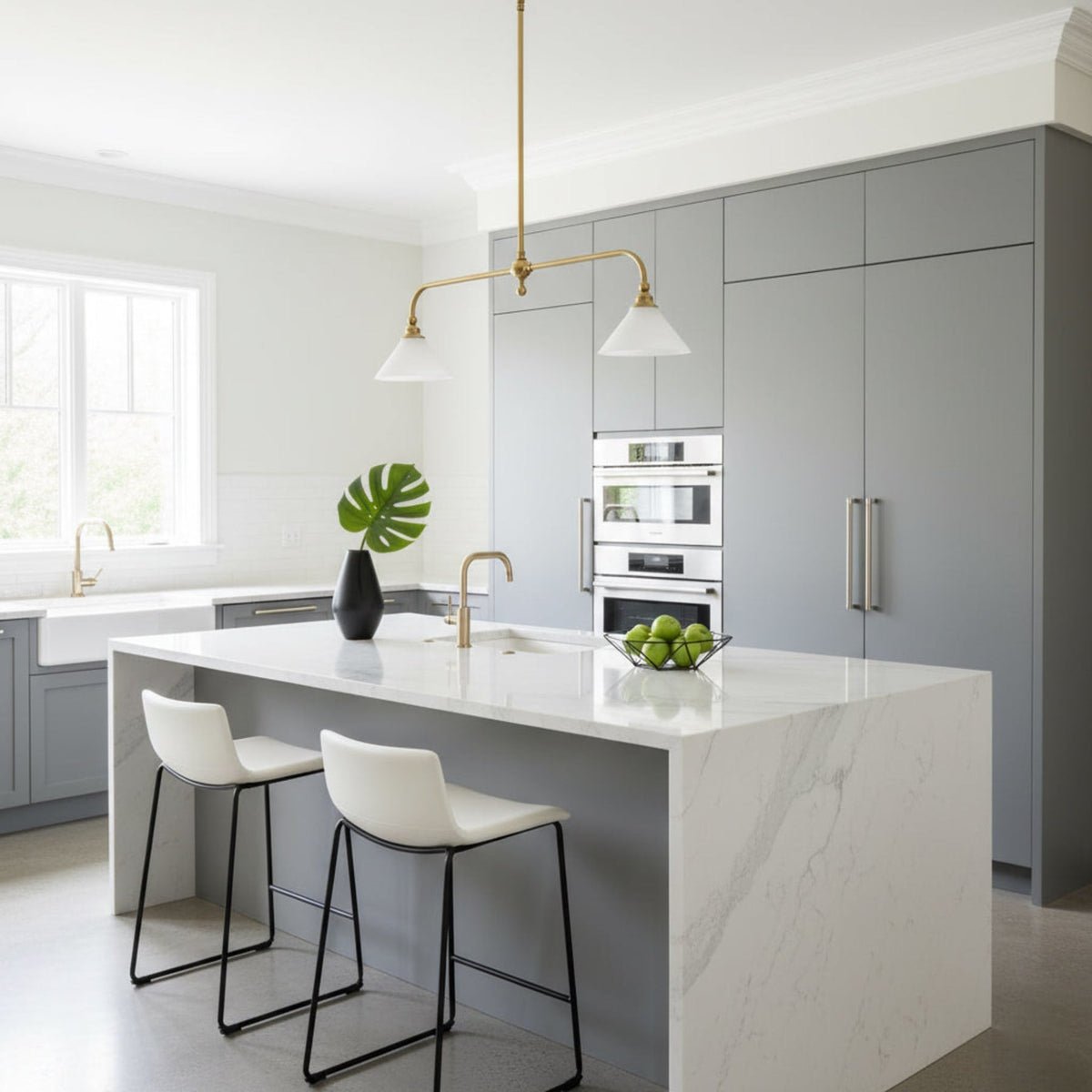 Two ceramic shades above a white kitchen island