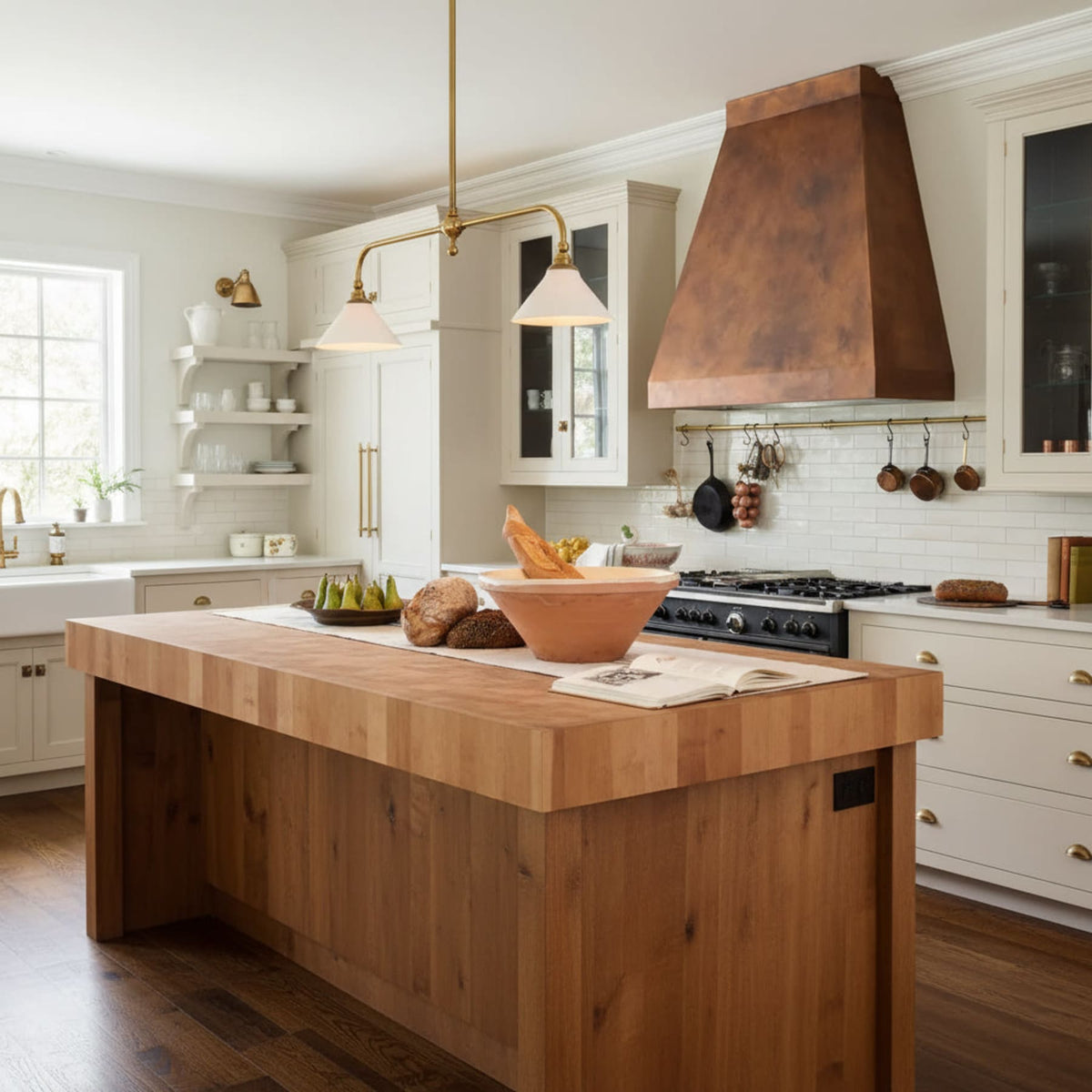 Brass pendant over a timber island with copper extractor hood