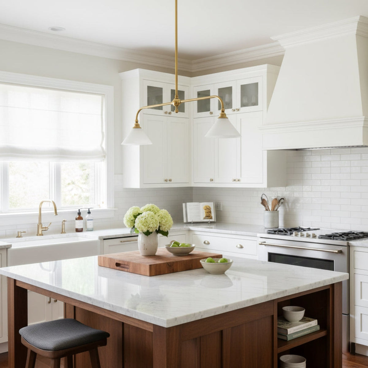 Two-light brass pendant in a bright white kitchen