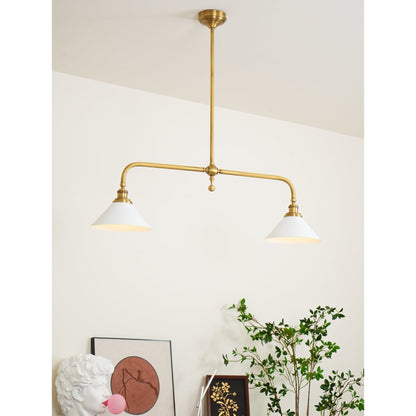 Two-light brass pendant above a cabinet