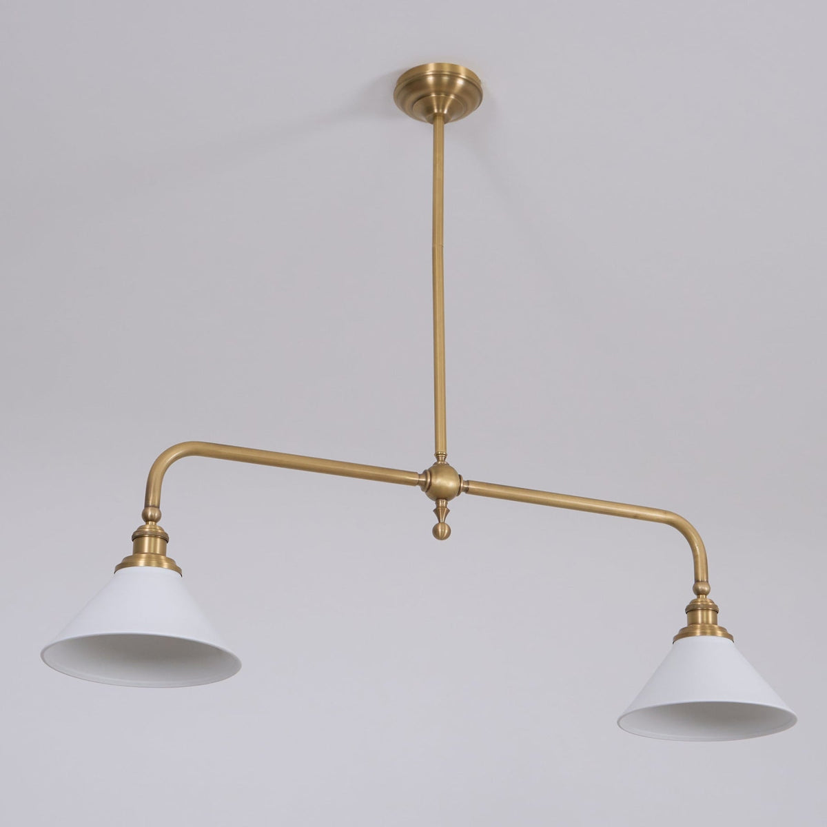 Angled view of ceramic shades and brass frame
