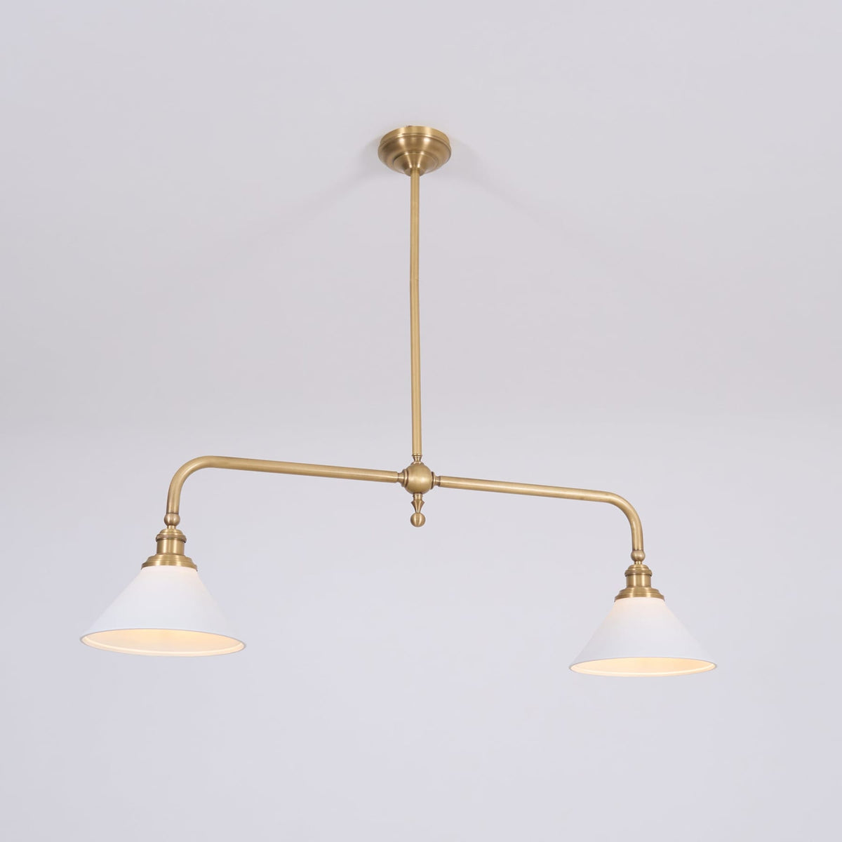 Warm light inside two ceramic pendant shades