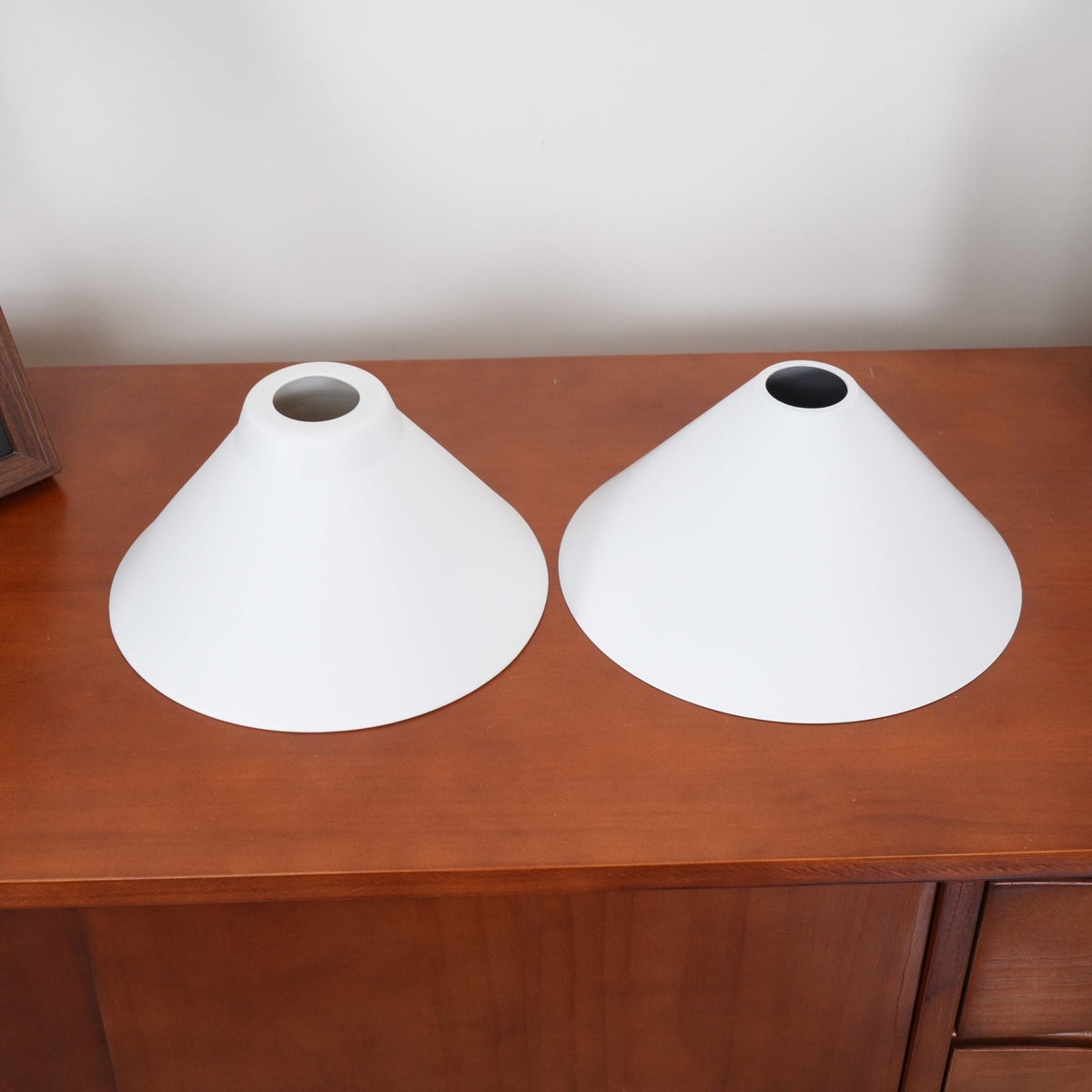 Top view of two white ceramic pendant shades