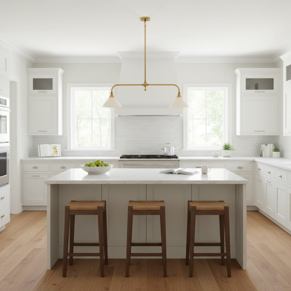 Two-light brass pendant in a white kitchen
