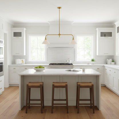 Two-light brass pendant in a white kitchen