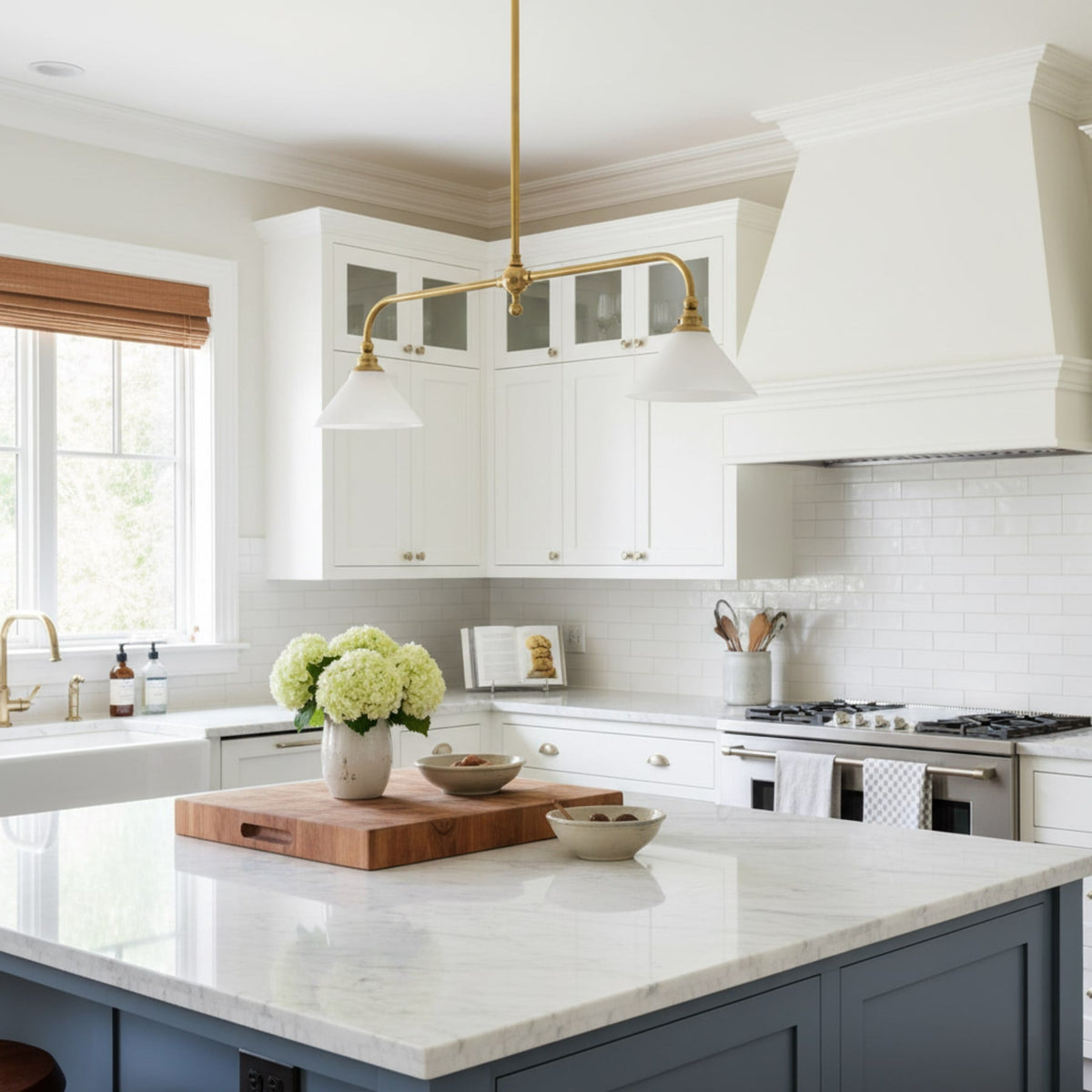 Brass pendant above a bright kitchen island