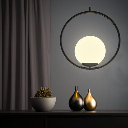 Black circular cage pendant light with glass globe