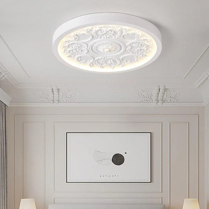 White rosette ceiling light with illuminated border
