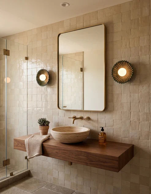 Flower wall sconces beside a bathroom mirror