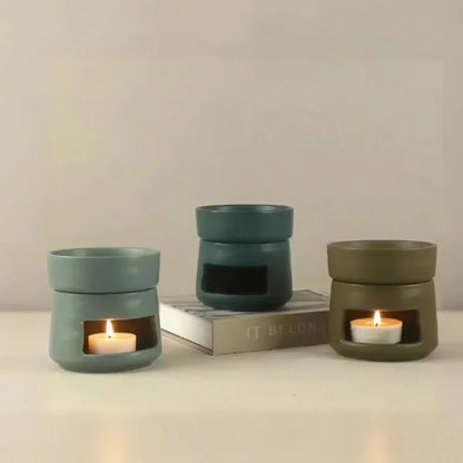 Ceramic tea light oil burners in green and olive finishes
