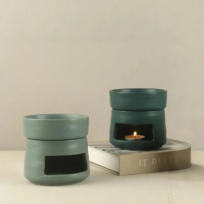 Green ceramic wax melt burners displayed together