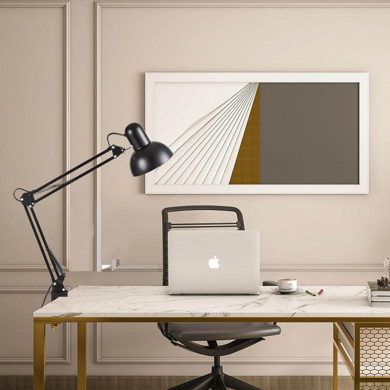 Black swing-arm desk lamp on a home office table