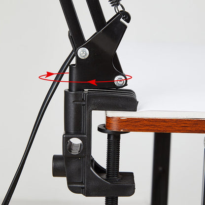 Rotating clamp attachment on the desk edge