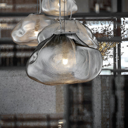 Grey cloud-shaped glass shade viewed close up