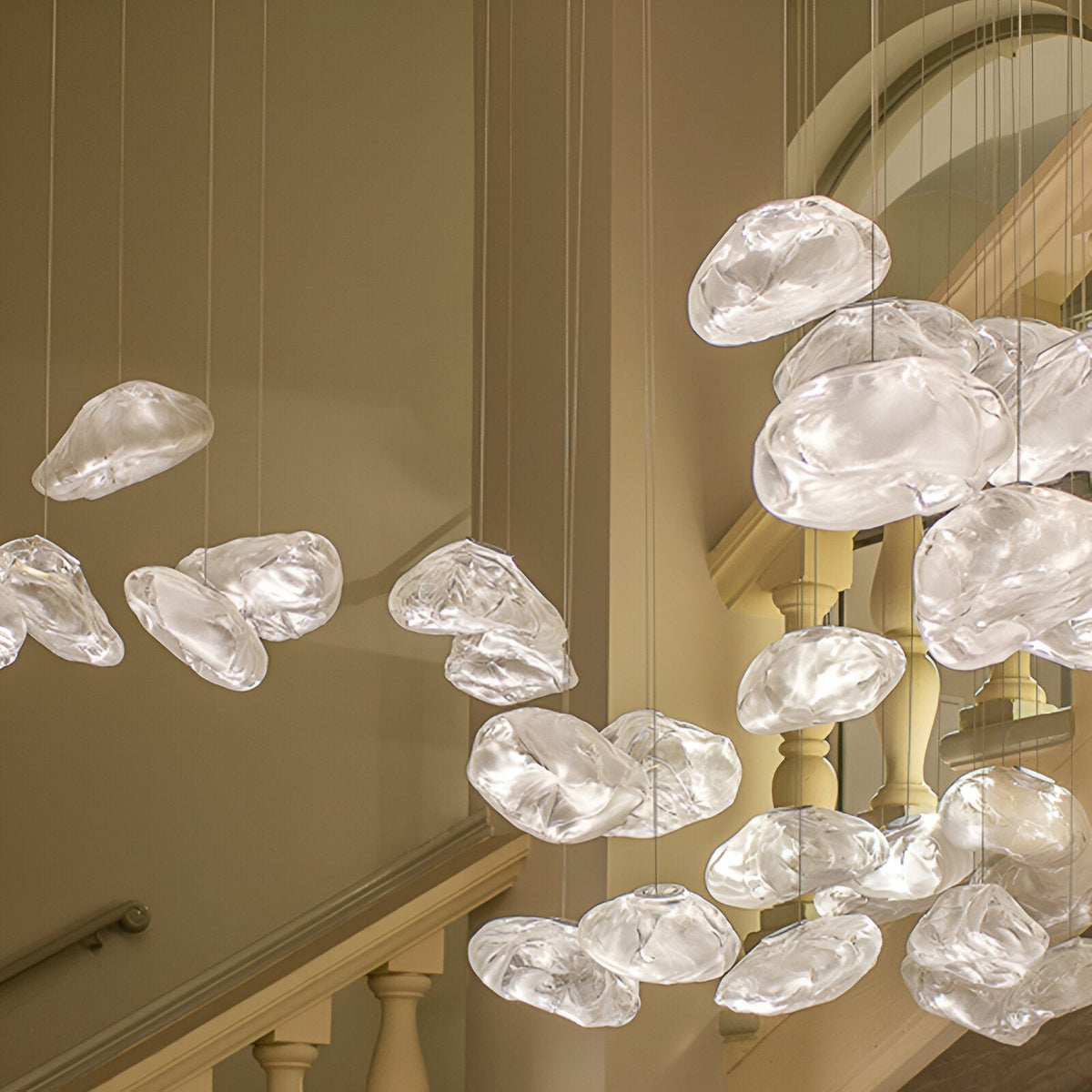 Clear glass cloud pendants in a stairwell