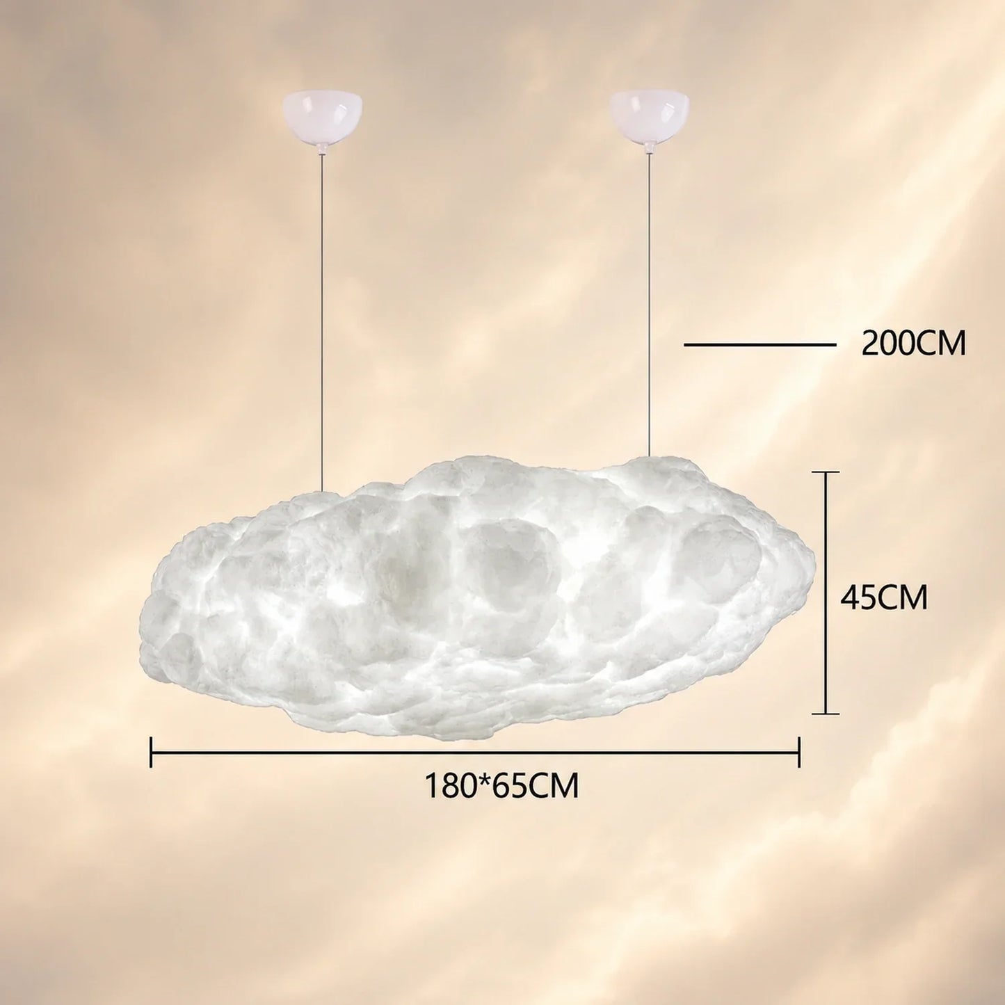 Large 180cm sculptural cloud pendant light hanging from two ceiling mounts, showing dimensions of 180x65cm and 45cm height against a soft sky background.