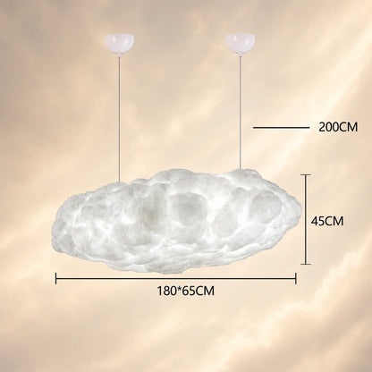 Large 180cm sculptural cloud pendant light hanging from two ceiling mounts, showing dimensions of 180x65cm and 45cm height against a soft sky background.