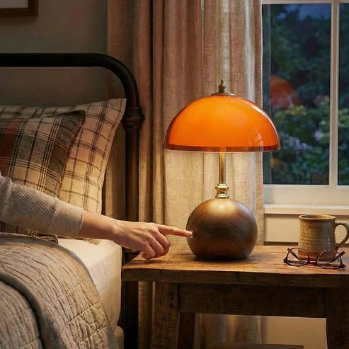 Coby lamp beside a bed with touch control