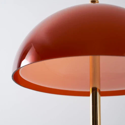 Close-up of acrylic dome shade and slim metal stem